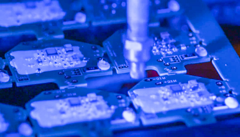 Small circuit boards being coated