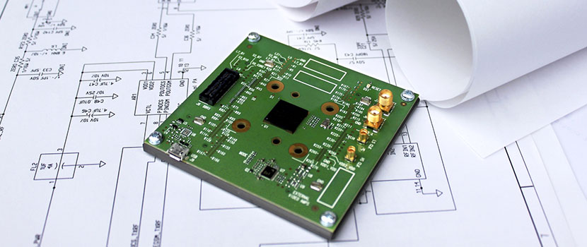 Circuit board lying on a schematic