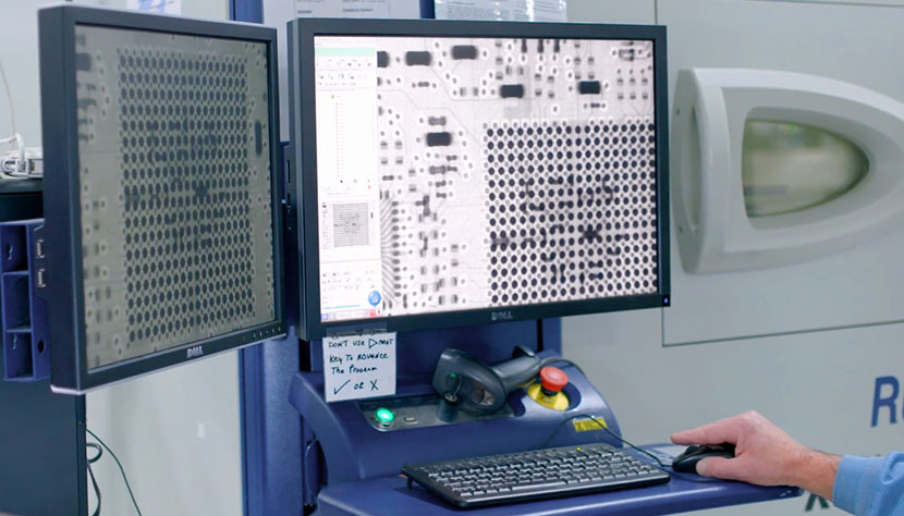 An x-ray of a circuit board on a computer monitor